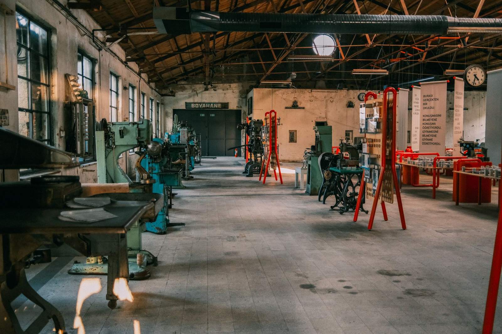 An industrial workshop featuring tools and equipment organized for roofing work.