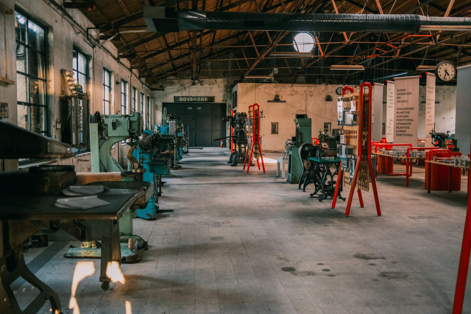 An industrial workshop featuring tools and equipment organized for roofing work.